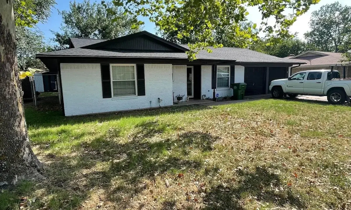 Professional roofing crew working on a residential roof in Edmond